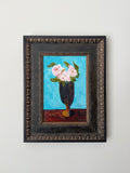 Original vintage floral still life painting of pink roses in a dark vase against a vivid blue background