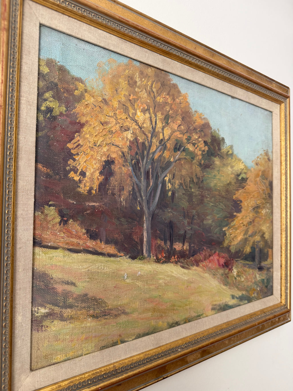 Angled close-up of the frame and painterly surface of Autumn Meadow